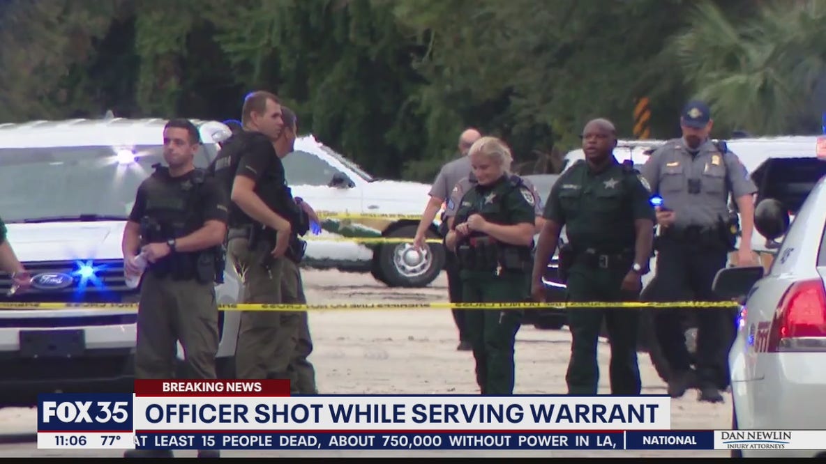 Officer shot while serving warrant